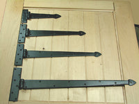 Premium spear style T hinges in black finish, ideal for gates and doors, showcasing a decorative strap design.