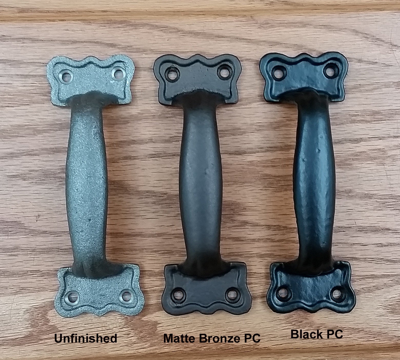Nostalgic farmhouse style door handle pulls in three finishes: unfinished, matte bronze, and black, each 5-3/4 inches long.