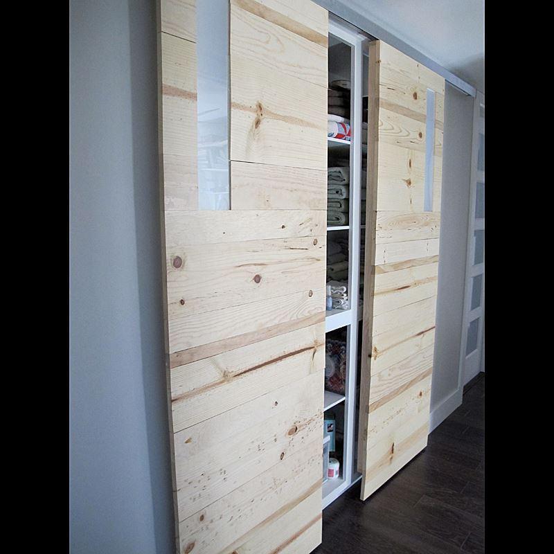 Modern aluminum barn door hardware with a 72-inch track designed for 36-inch doors, showcasing a sleek installation.