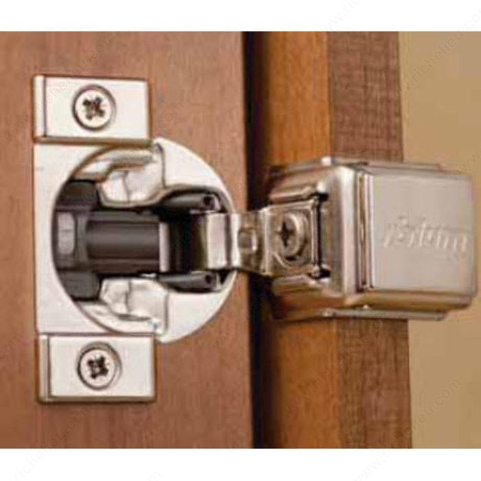 Compact Blumotion concealed cabinet hinge with 1 1/2" overlay and 110° opening, ideal for smooth cabinet doors.