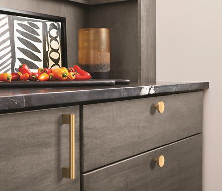 Versa Series cabinet knobs in 1-3/8 inch size, available in multiple finishes, enhancing modern cabinetry.