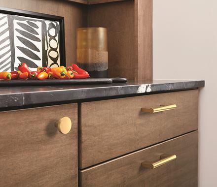 Versa Series cabinet knobs, 1-3/8 inch, available in multiple finishes, enhancing modern cabinetry style.