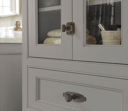 Highland Ridge cabinet latches in 1-7/8 inch size, available in multiple finishes for secure cabinet closure.