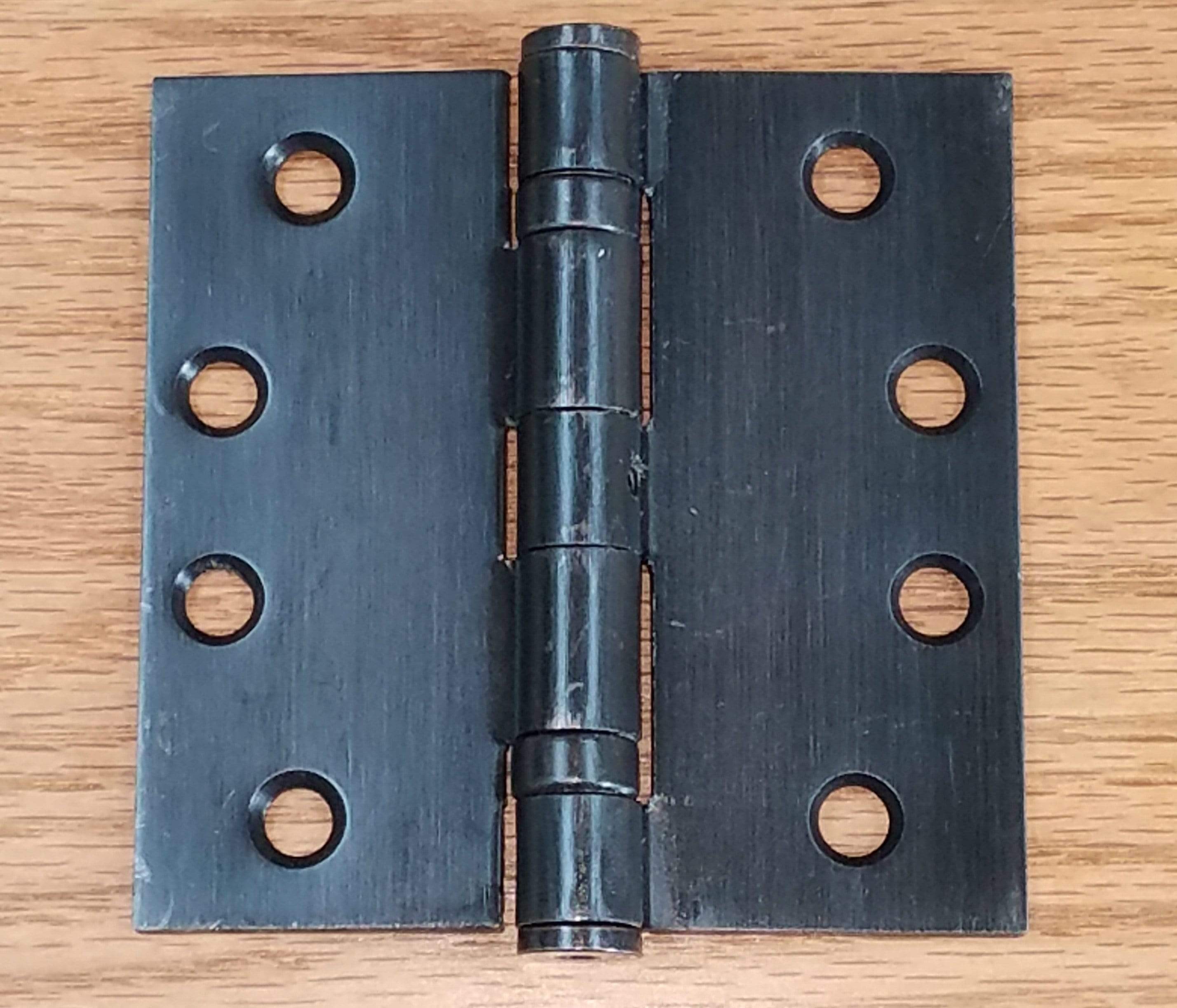 Commercial ball bearing door hinge, 4 inches square, available in multiple finishes, sold in pairs for durability.