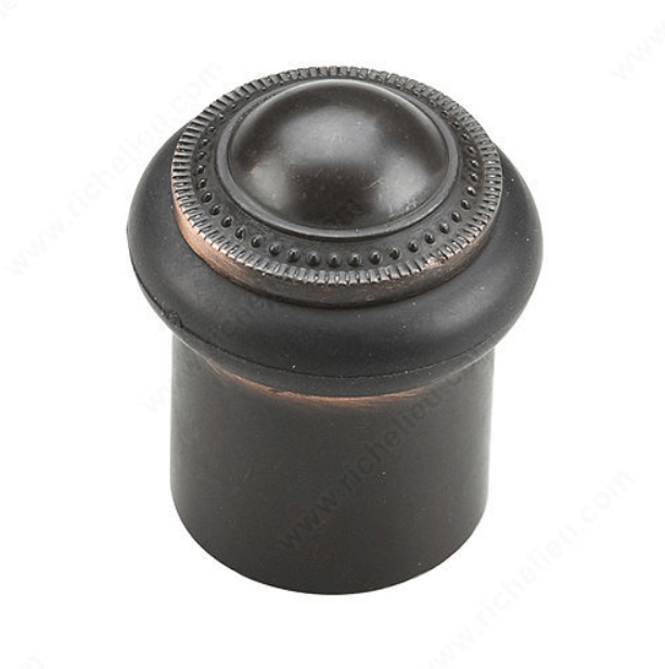 Decorative door stopper measuring 1 13/16 inches, available in multiple finishes, sold individually for home use.