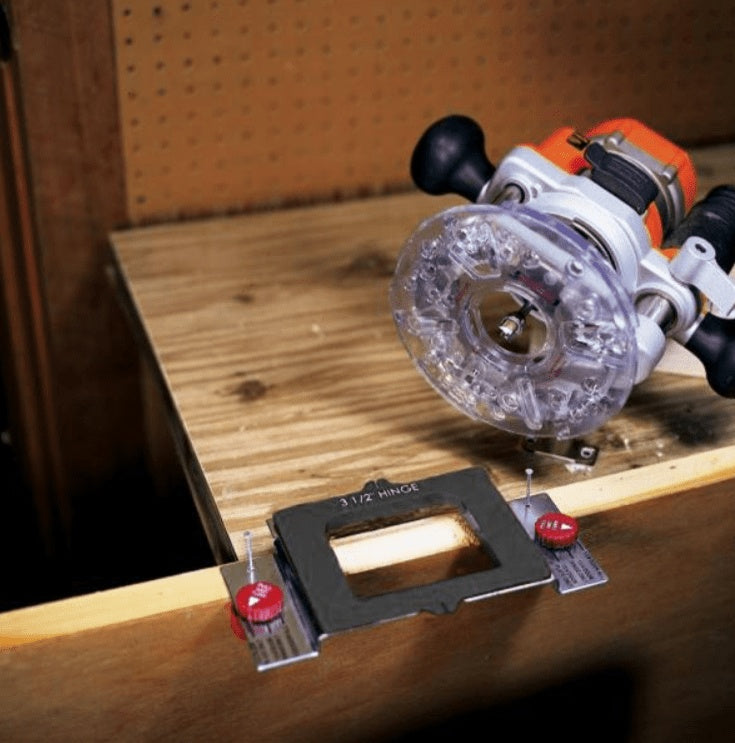 Door hinge jig installation kit with router and templates for precise hinge placement in woodworking projects.