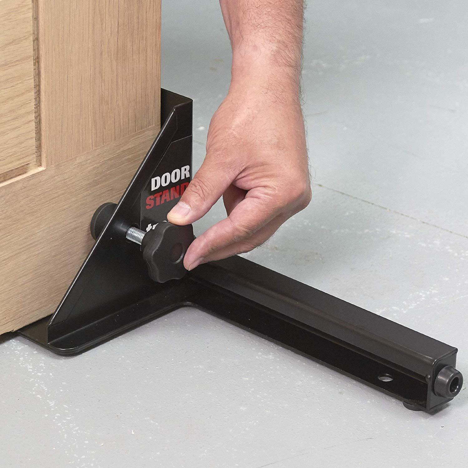Adjustable door holder stand for easy door installation, featuring a sturdy base and a secure locking mechanism.