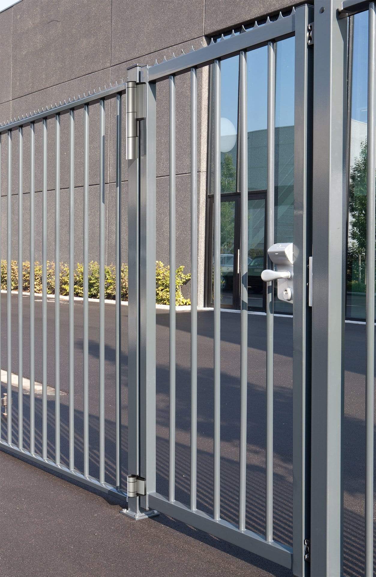 Locinox Mammoth commercial gate closer and lock kit displayed on a modern metal gate in an outdoor setting.