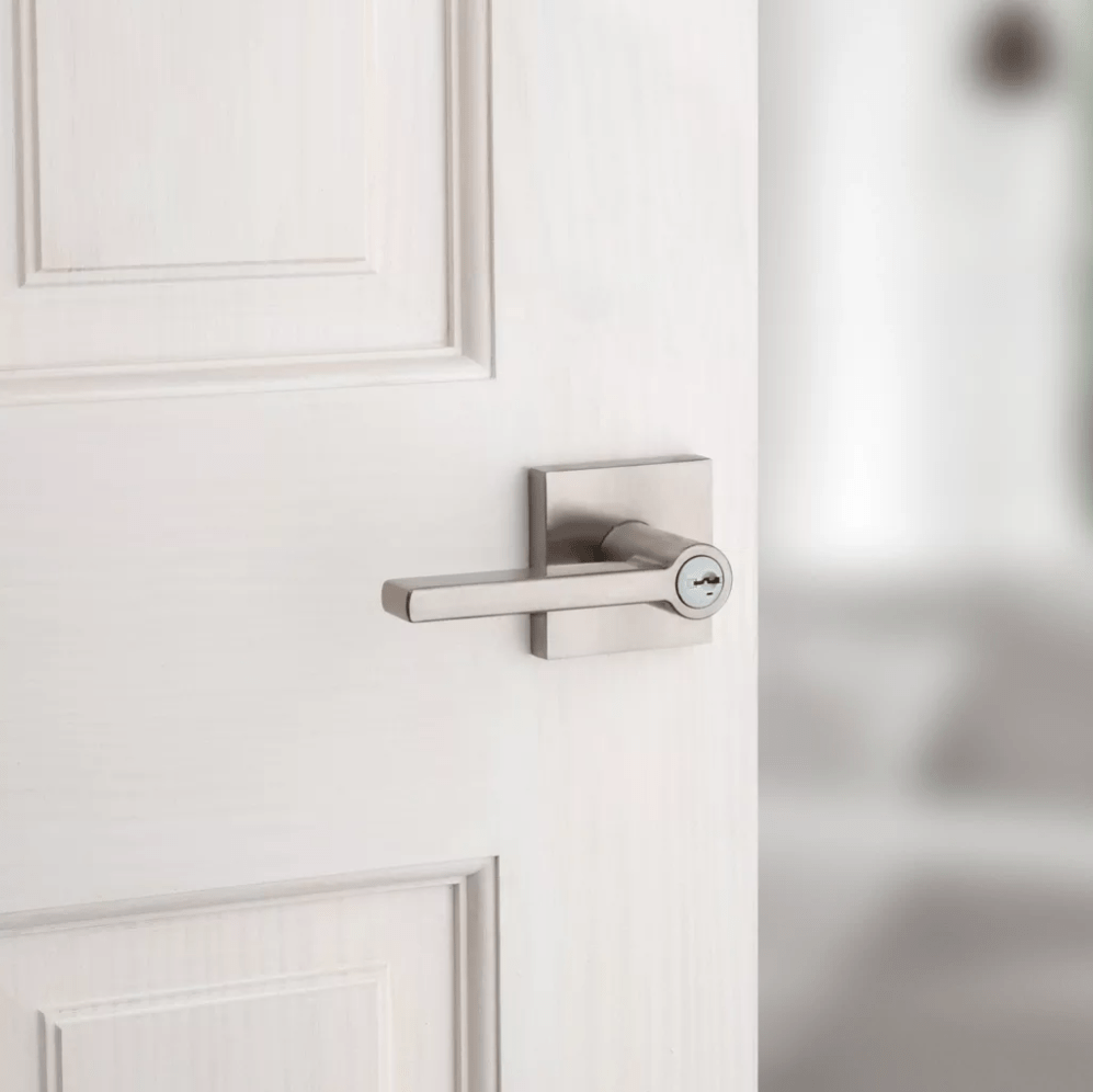 Kwikset Halifax square design entry door lever lock in satin nickel finish with SmartKey security feature.