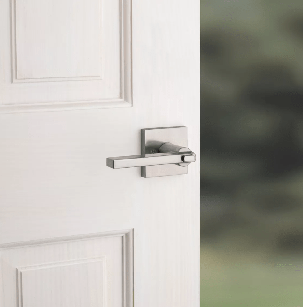 Satin nickel entry door lever lock with SmartKey security in Halifax square design for residential use.
