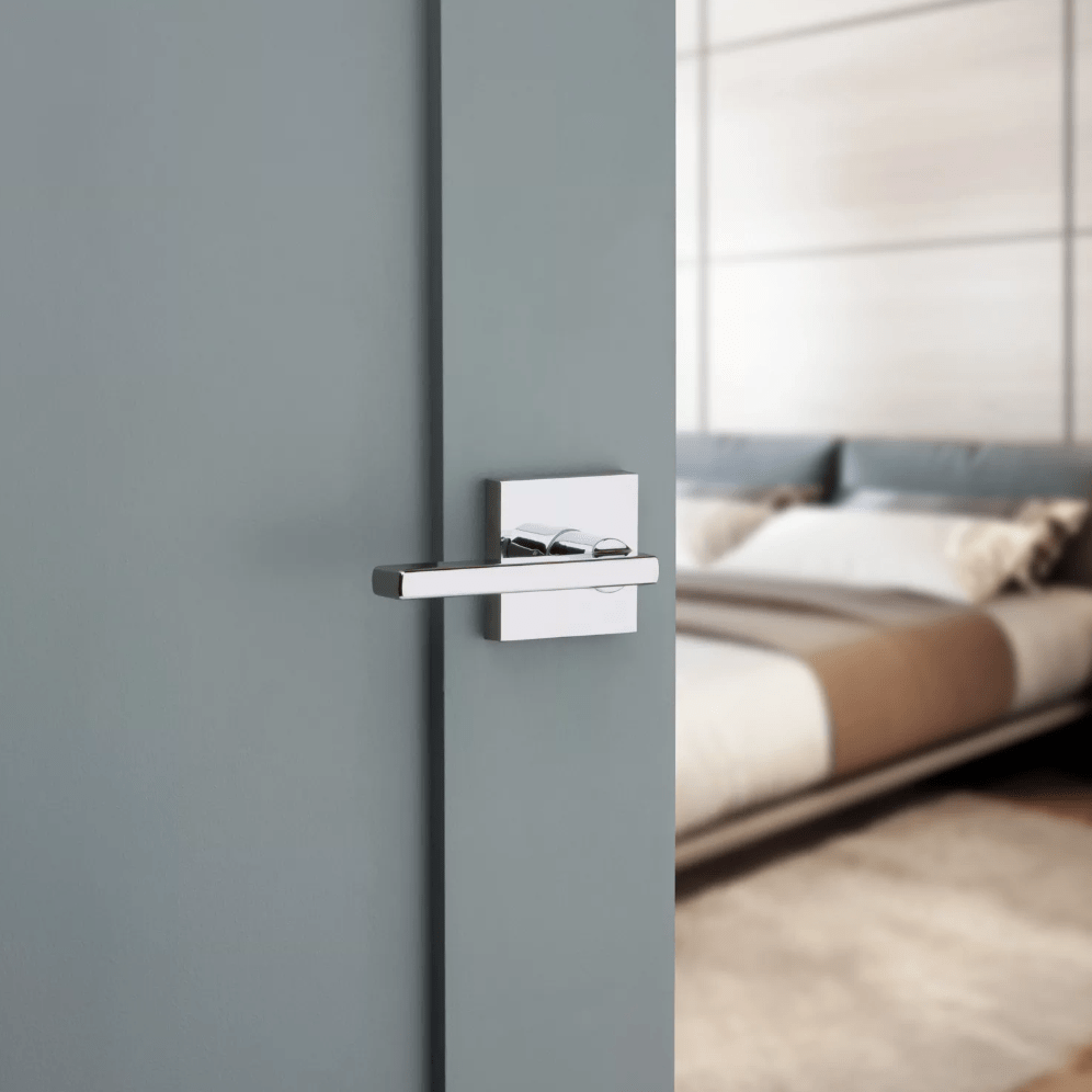 Bright polished chrome non-locking passage lever in Halifax square style for residential doors, sold individually.