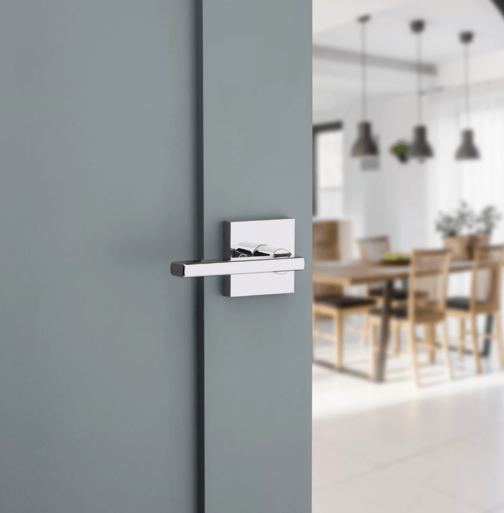 Kwikset Halifax square non-locking passage door lever in bright polished chrome finish, ideal for residential use.