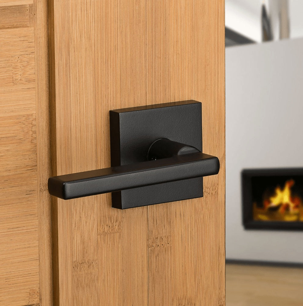 Kwikset Halifax square non-locking passage lever in iron black finish, ideal for residential doors. Sold individually.