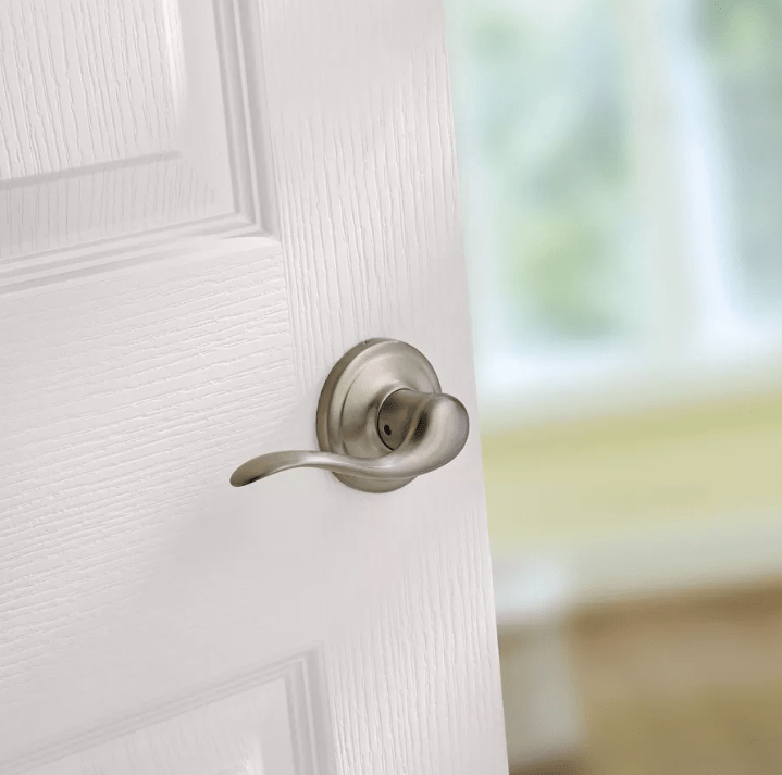 Satin nickel non-locking passage lever door handle in Tustin style with Microban antimicrobial protection.