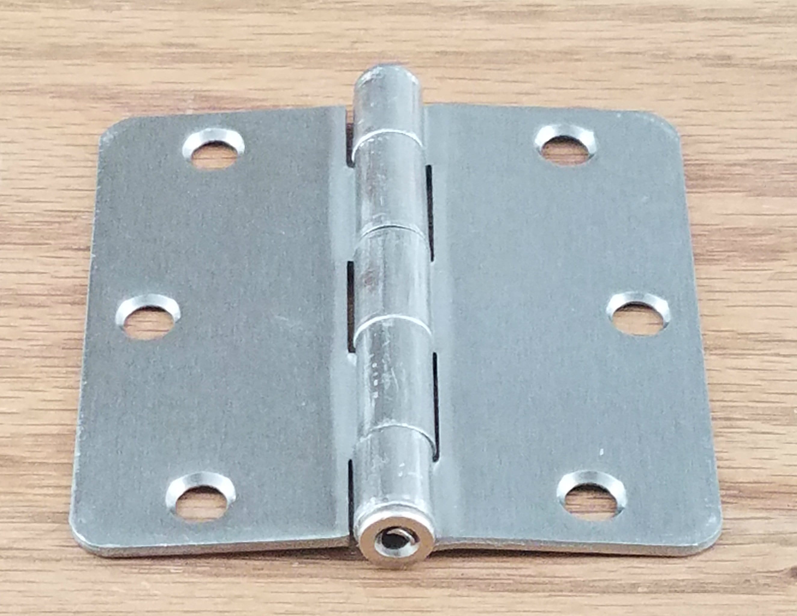 Plain bearing satin nickel door hinges, 3.5 inches with 1/4 inch radius, sold in a 2 pack for residential use.