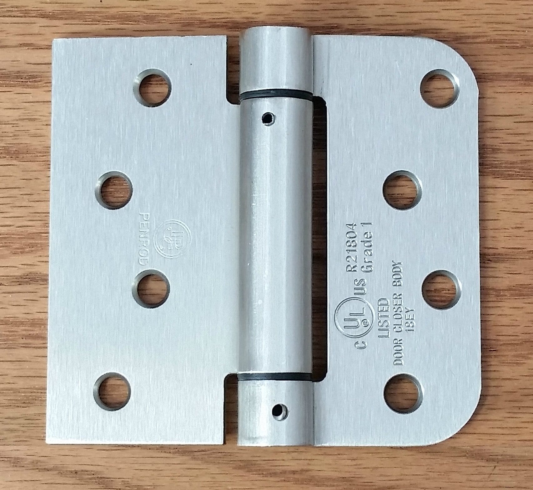 Self-closing Penrod spring hinge 4" x 4.25" with 5/8" square radius in satin nickel finish for doors.