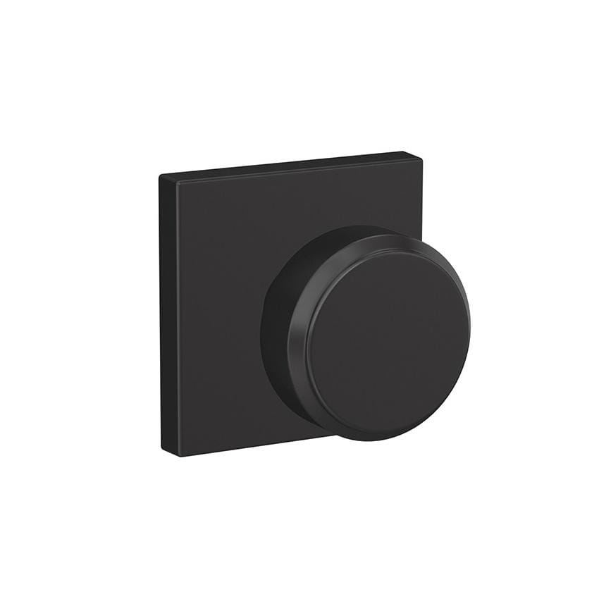Matte black Schlage Custom residential door knob with combined passage and privacy lock, featuring Bowery style knob and Collins rose trim.