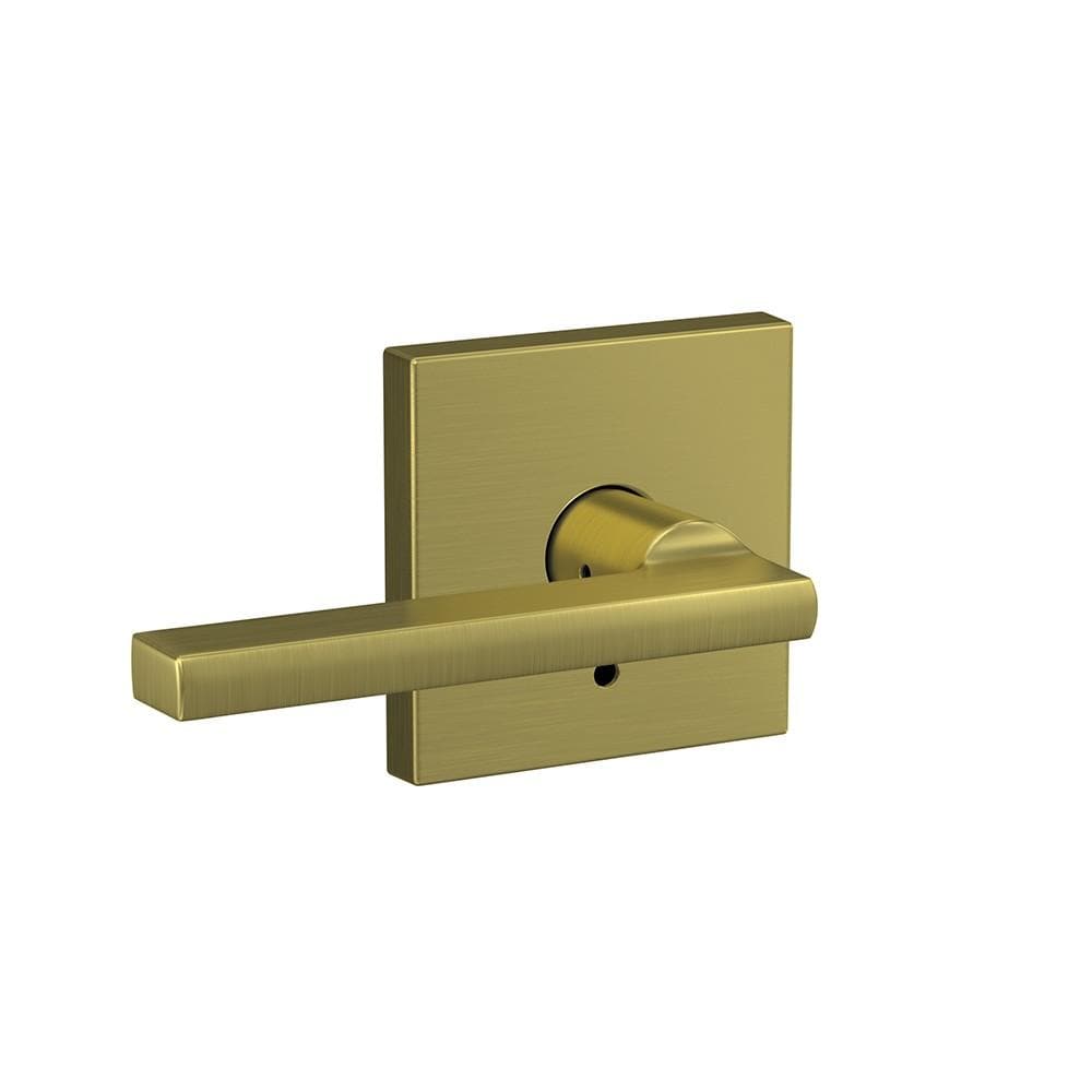 Satin brass Schlage custom residential door lever with combined passage and privacy lock in Latitude style and Collins rose trim.
