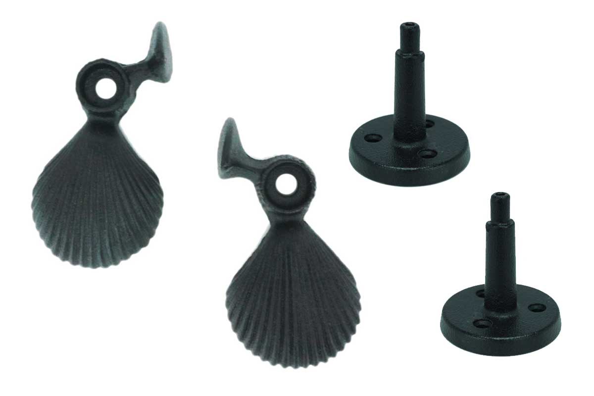Cast iron shutter dogs in a shell design with a black powder coat, sold in pairs, measuring 5-1/4 inches.