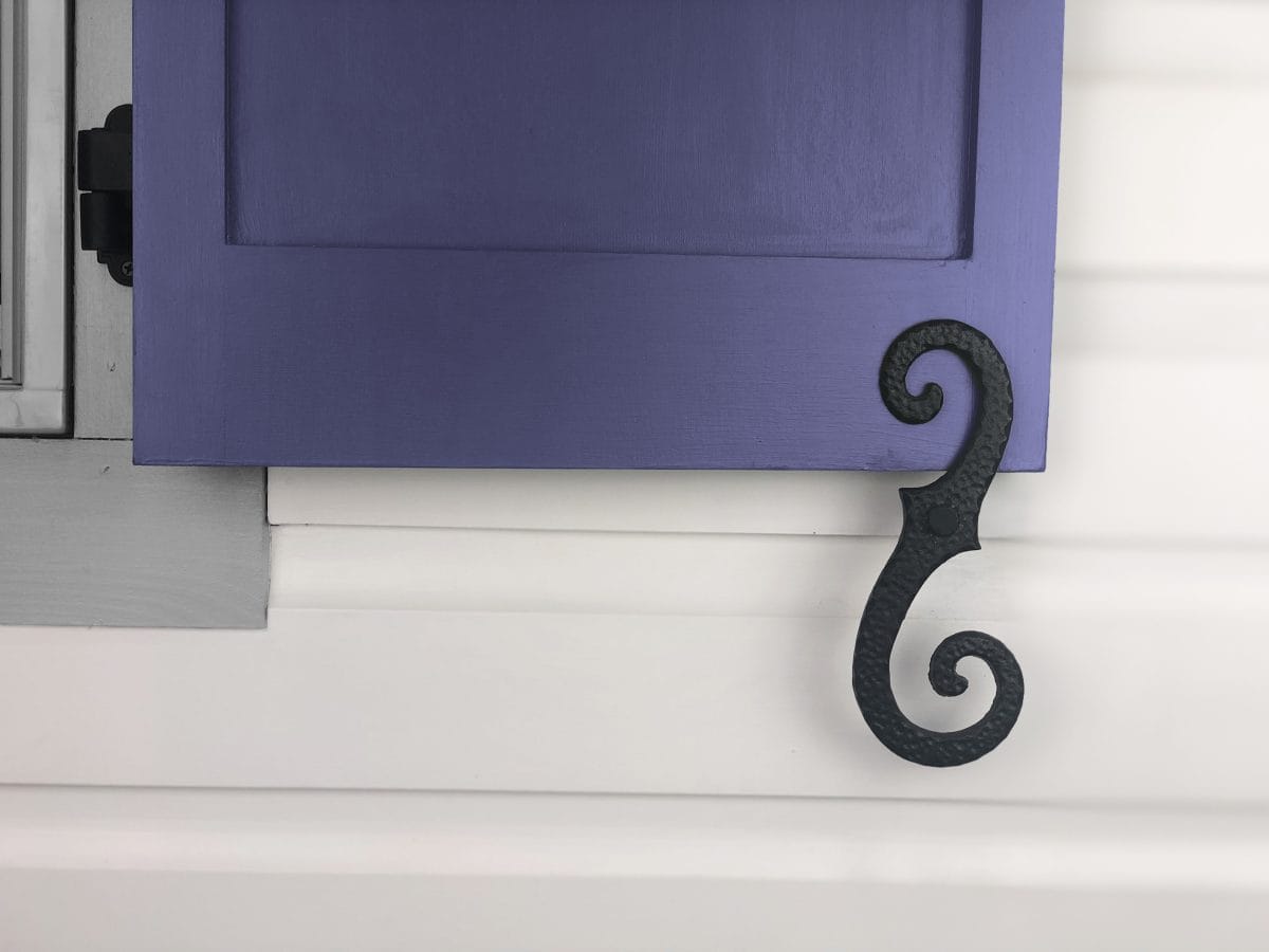 Large stippled scroll shutter dog tieback in black powder coat, 8 inches, cast iron, sold in pairs for window shutters.