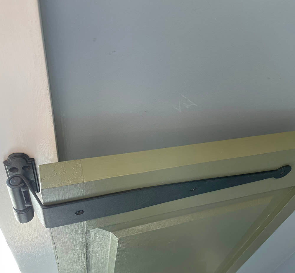 Black powder-coated strap hinges for shutters, 12-inch circle tip design, minimal offset, sold in pairs.