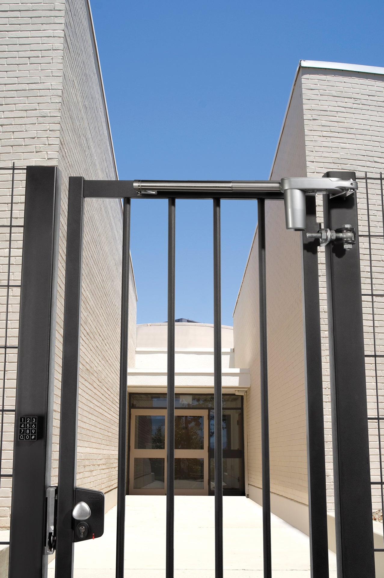 Surface mounted electric gate lock for square profiles, featuring fail open functionality and available in multiple finishes.