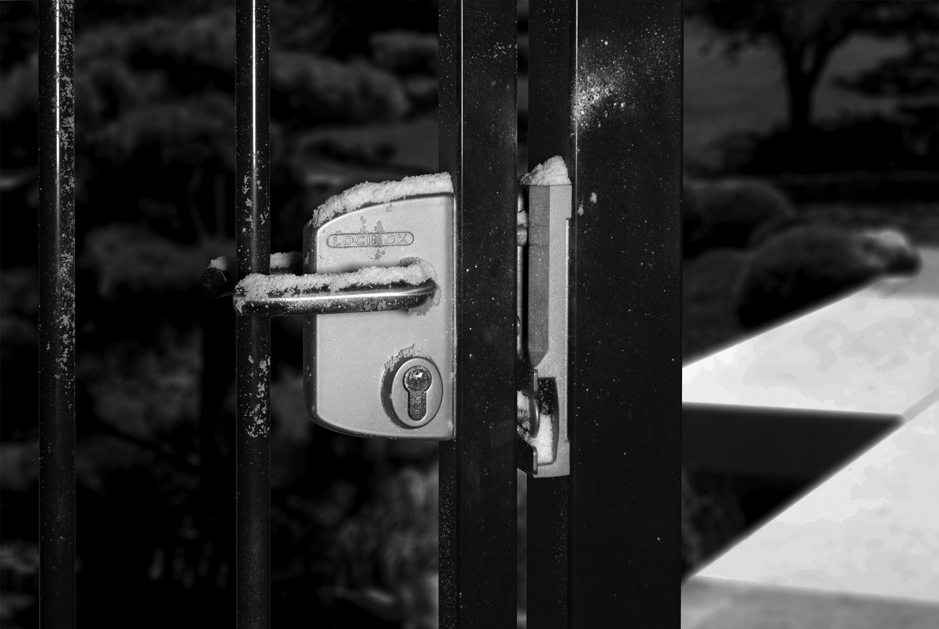 Surface mounted gate lock designed for square or flat profiles, suitable for 3/8" to 3" widths, available in multiple finishes.
