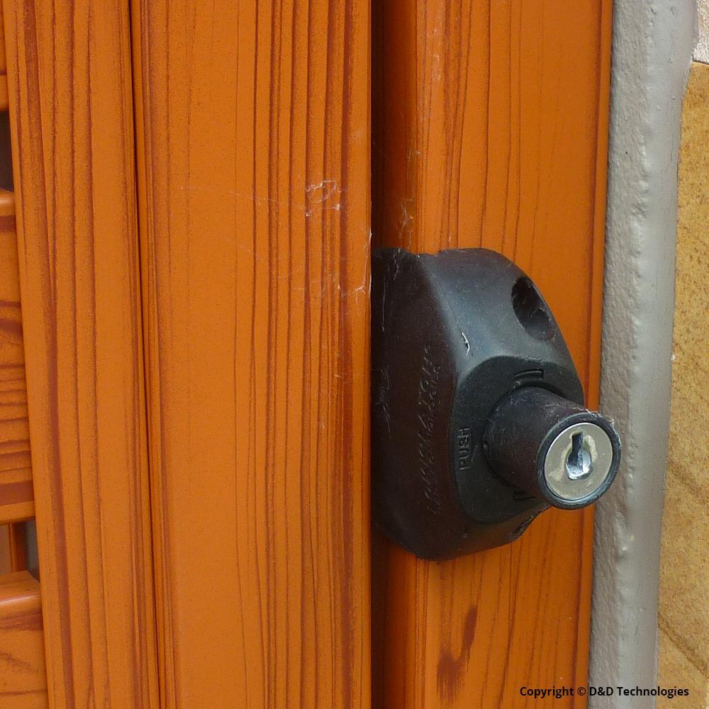 Black gate security latch with a lockable feature, designed for two-sided access and keyed alike functionality.